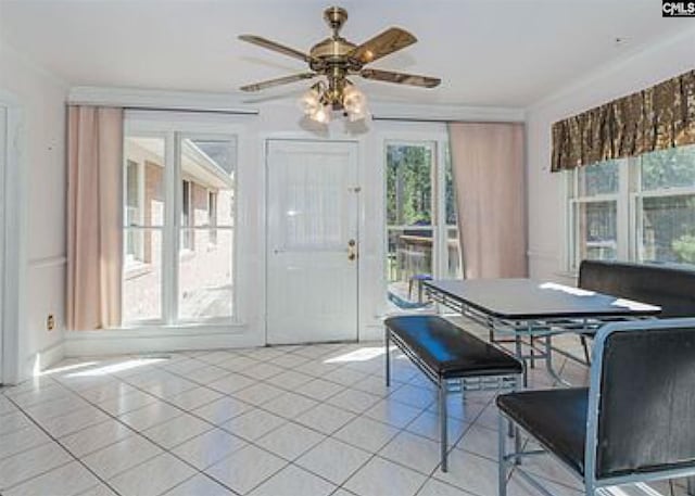 dining room with light tile floors and ceiling fan