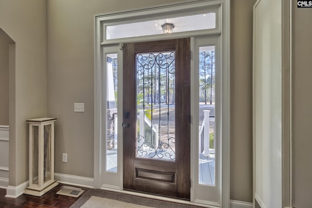 foyer with dark hardwood / wood-style floors