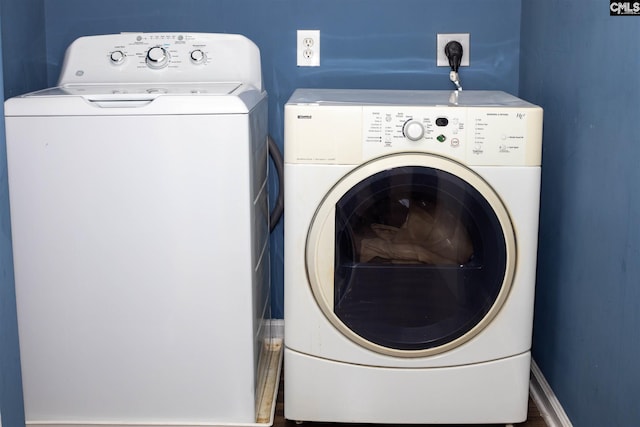 laundry room featuring hardwood / wood-style flooring, separate washer and dryer, and hookup for an electric dryer