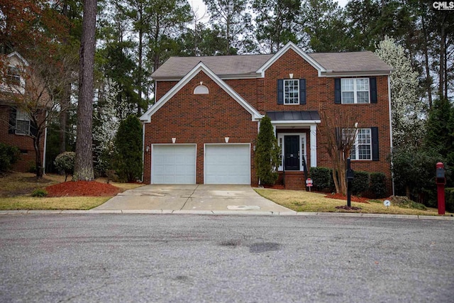 view of front of property with a garage