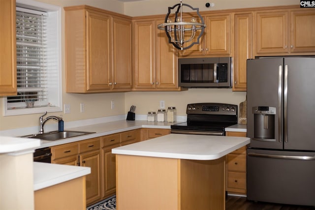 kitchen featuring appliances with stainless steel finishes, an inviting chandelier, hanging light fixtures, a kitchen island, and sink