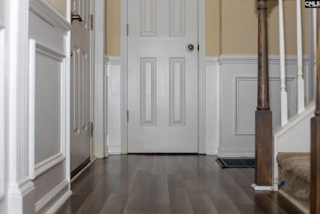 entryway with dark hardwood / wood-style flooring