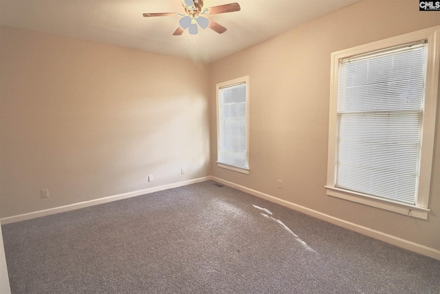 carpeted empty room with ceiling fan