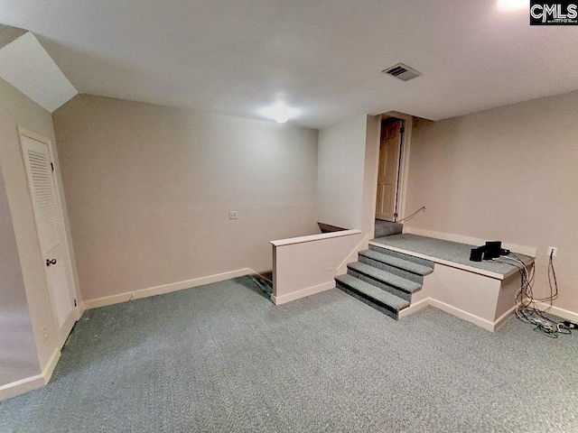 basement featuring carpet flooring