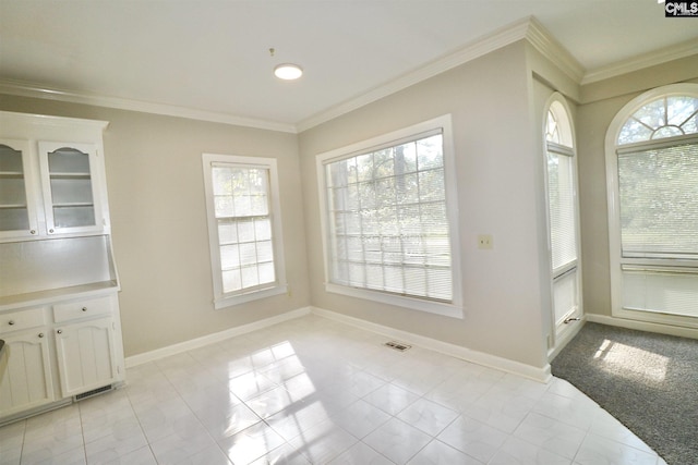 tiled dining room with ornamental molding