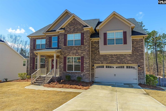 craftsman-style house featuring a front lawn and a garage