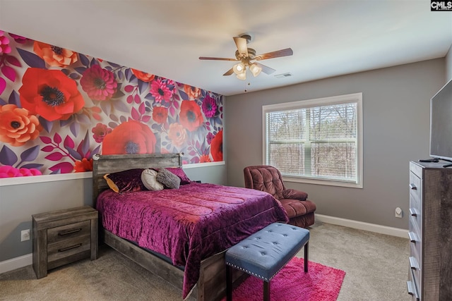 bedroom with ceiling fan and light carpet