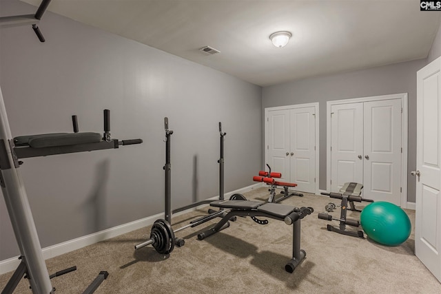workout room featuring carpet