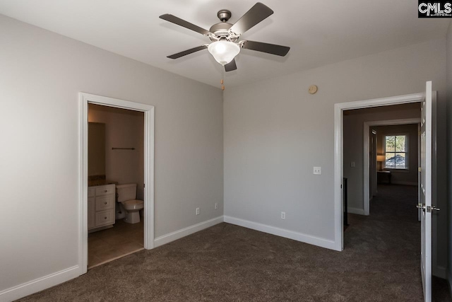 unfurnished bedroom featuring connected bathroom, ceiling fan, and dark colored carpet