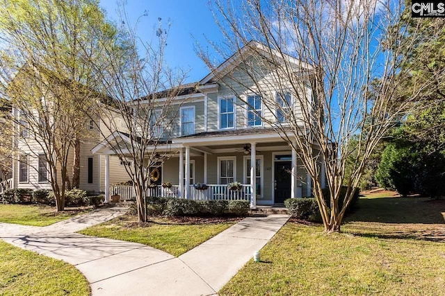 view of front facade with a front yard and a porch