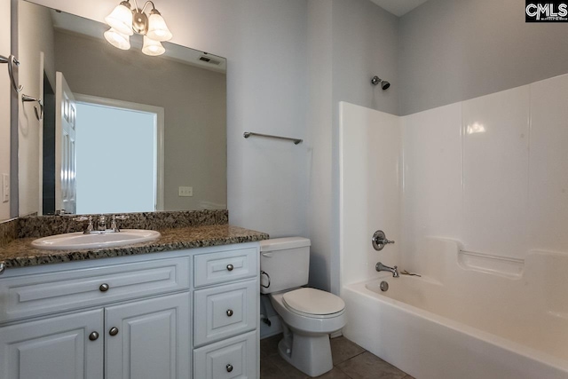 full bathroom with a chandelier, toilet, oversized vanity, shower / bathtub combination, and tile flooring