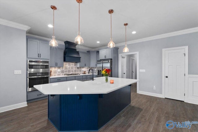 kitchen featuring pendant lighting, custom exhaust hood, dark hardwood / wood-style flooring, and stainless steel appliances