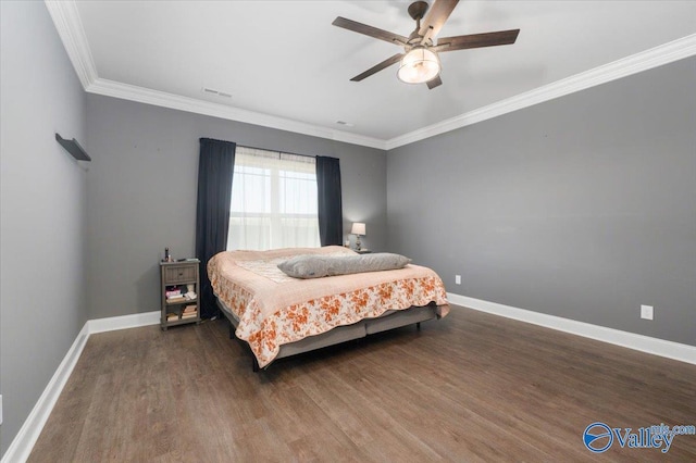 bedroom featuring ceiling fan, dark hardwood / wood-style floors, and ornamental molding