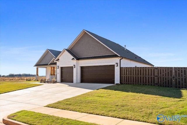 view of front facade with a front yard and a garage