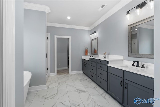 bathroom featuring vanity, crown molding, and a tub