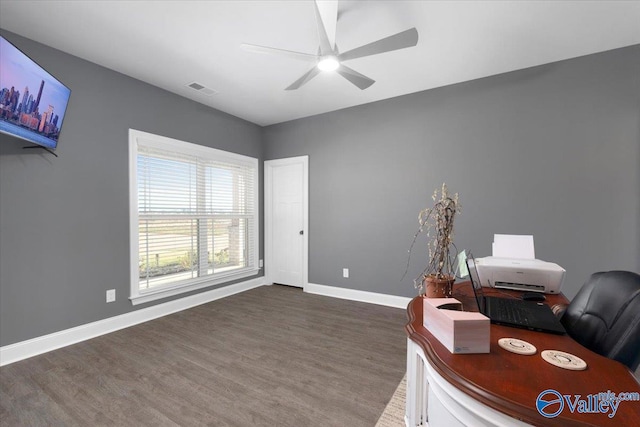 office with dark hardwood / wood-style floors and ceiling fan