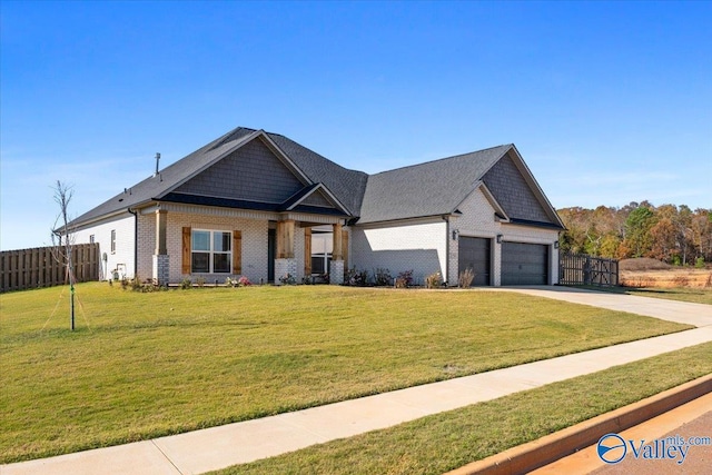 craftsman-style home with a garage and a front lawn