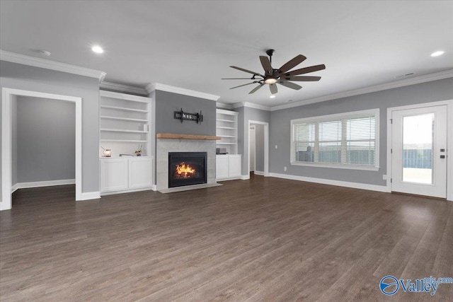 unfurnished living room featuring dark hardwood / wood-style flooring, ceiling fan, and crown molding