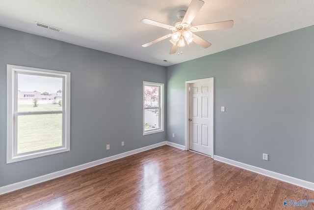 11228 Stewart Rd, Tanner, AL 35671 - spare room with healthy amount of natural light, ceiling fan, and wood finished floors