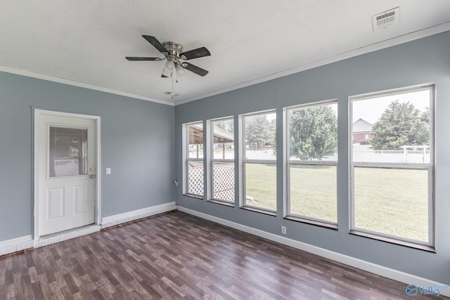 11228 Stewart Rd, Tanner, AL 35671 - spare room featuring plenty of natural light, ornamental molding, dark wood finished floors, baseboards, and a ceiling fan