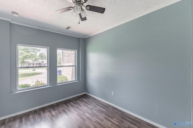 11228 Stewart Rd, Tanner, AL 35671 - spare room with a textured ceiling, dark wood finished floors, baseboards, and crown molding