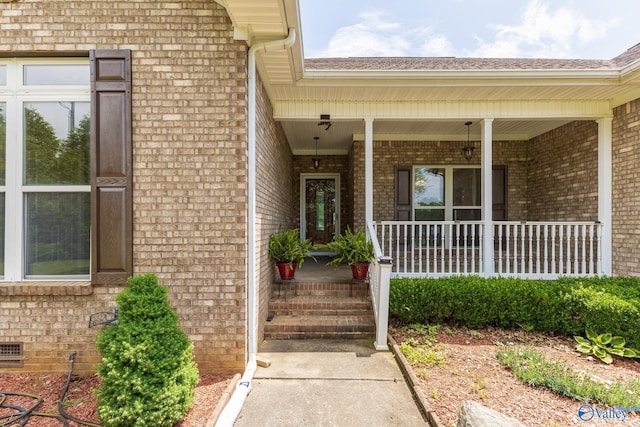11228 Stewart Rd, Tanner, AL 35671 - view of exterior entry featuring brick siding and covered porch