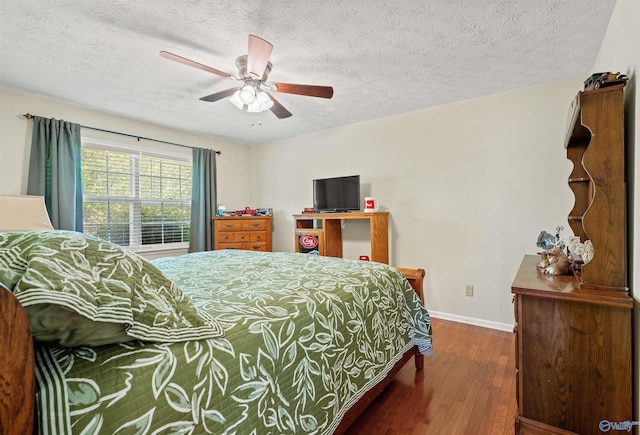 bedroom with hardwood / wood-style flooring, baseboards, a textured ceiling, and ceiling fan