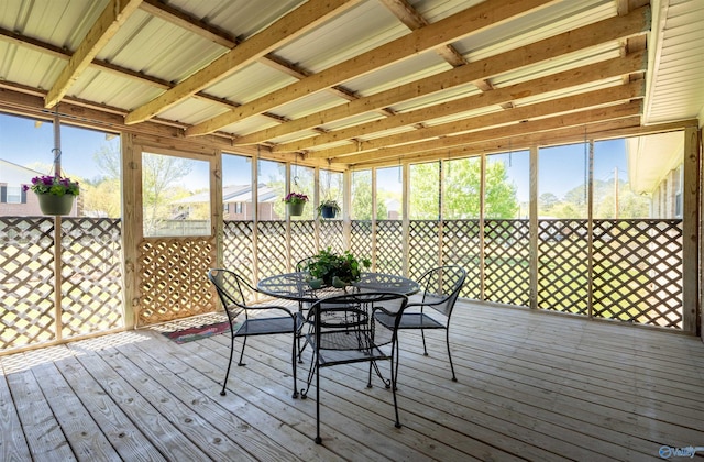 sunroom / solarium featuring outdoor dining area