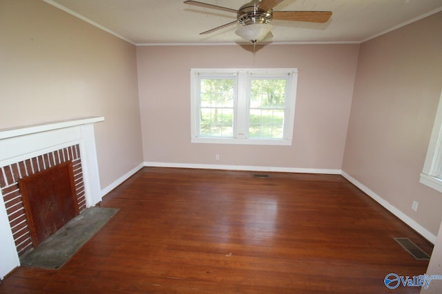 unfurnished living room with a fireplace, ornamental molding, ceiling fan, and dark hardwood / wood-style floors