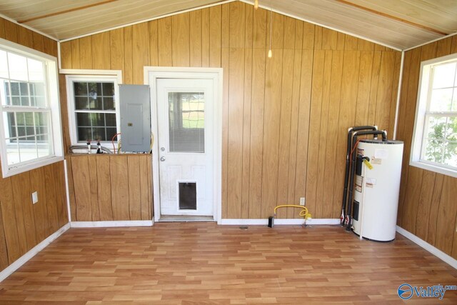 interior space with water heater and electric panel