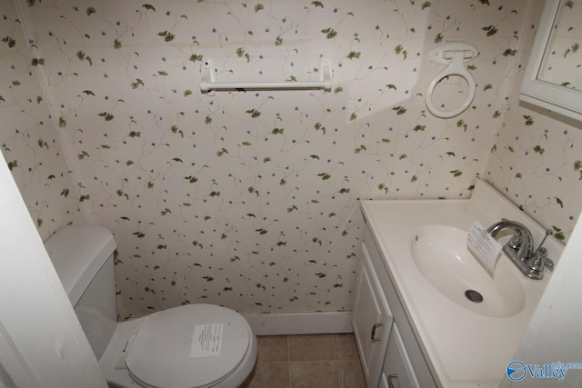 bathroom featuring vanity, toilet, and tile patterned floors