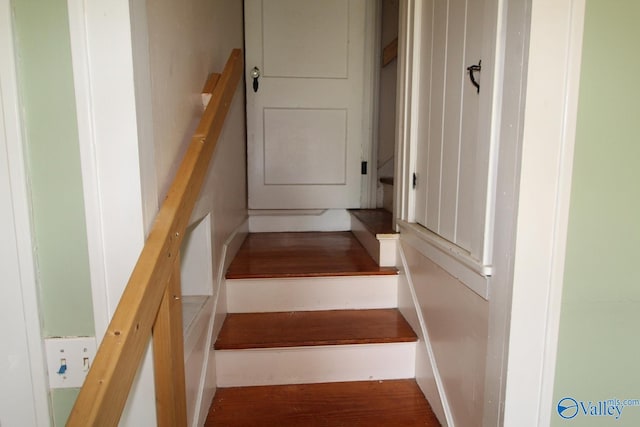 stairs featuring hardwood / wood-style flooring