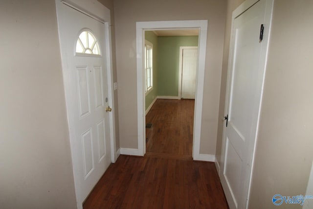 hall with dark hardwood / wood-style floors