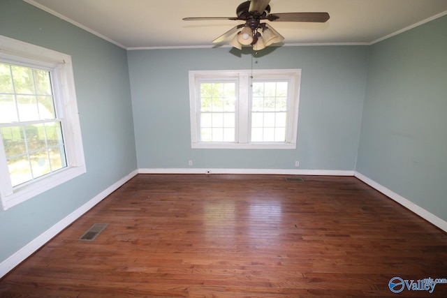 unfurnished room with ceiling fan, dark hardwood / wood-style flooring, and ornamental molding