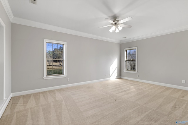 unfurnished room featuring a healthy amount of sunlight, baseboards, and light colored carpet