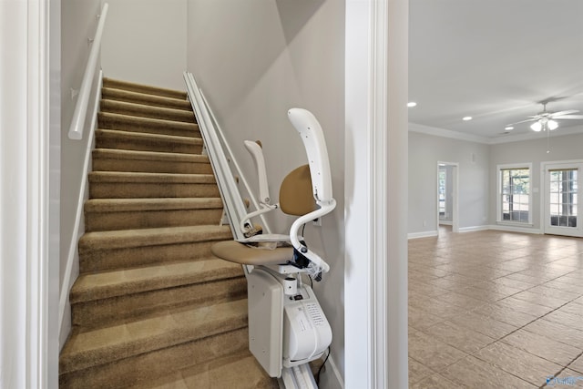 staircase featuring a ceiling fan, baseboards, crown molding, and recessed lighting