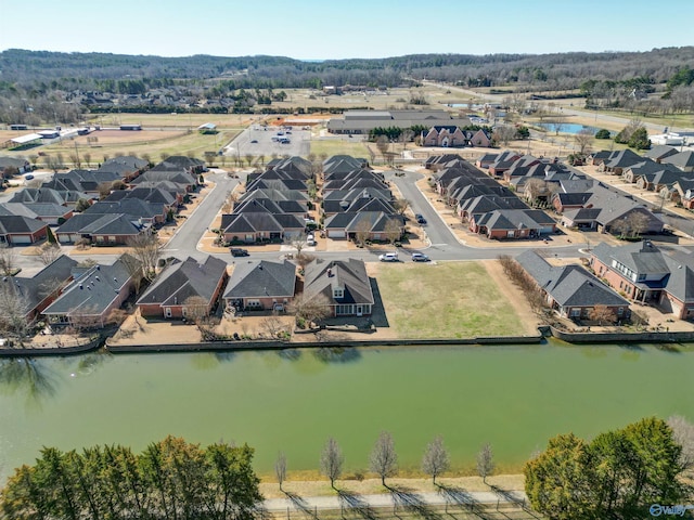 bird's eye view with a water view and a residential view