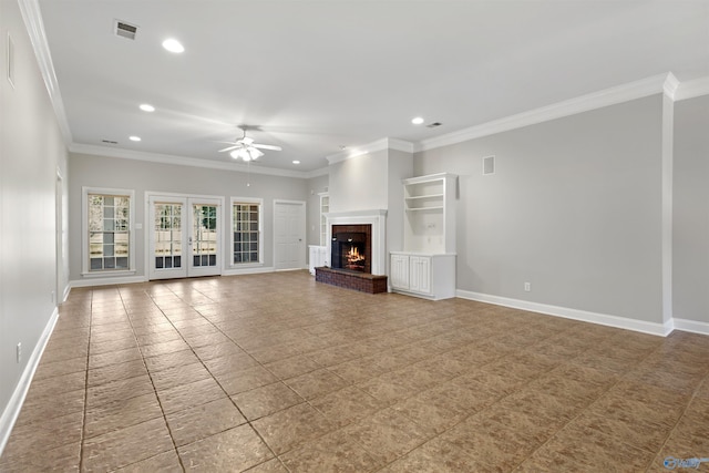 unfurnished living room featuring crown molding, recessed lighting, visible vents, a brick fireplace, and baseboards