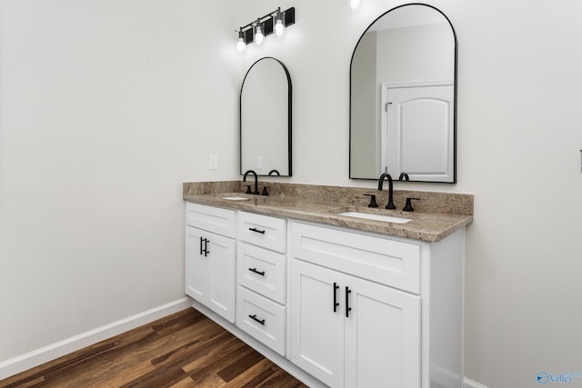 4452 Sibert St S, Gadsden, AL 35903 - full bathroom with double vanity and wood finished floors
