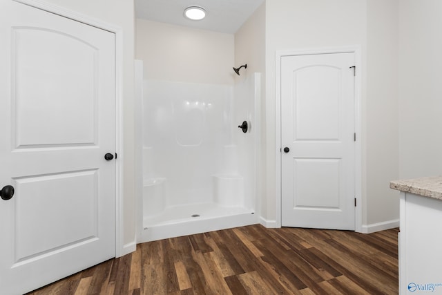 4452 Sibert St S, Gadsden, AL 35903 - bathroom with wood finished floors, a shower, and vanity
