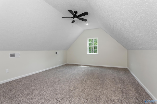 4452 Sibert St S, Gadsden, AL 35903 - additional living space with a textured ceiling, ceiling fan, carpet, and lofted ceiling
