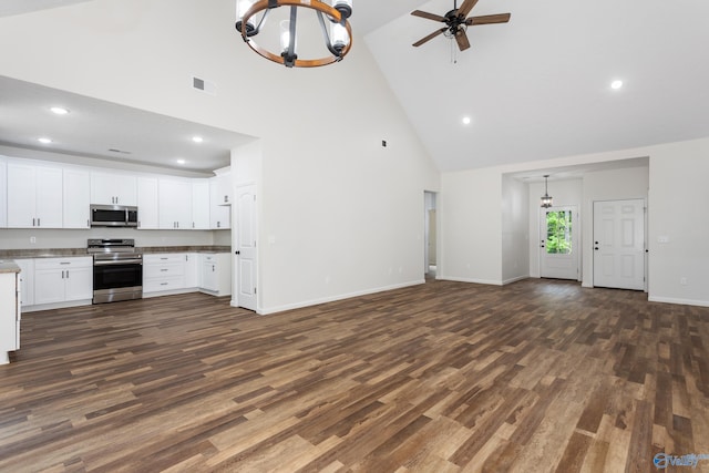 4452 Sibert St S, Gadsden, AL 35903 - unfurnished living room with high vaulted ceiling, dark wood-style floors, a chandelier, recessed lighting, and ceiling fan