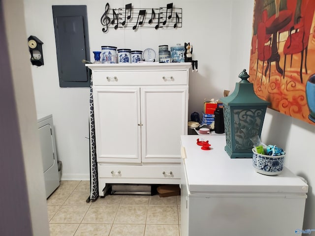 mudroom featuring washer / clothes dryer, electric panel, and light tile patterned floors