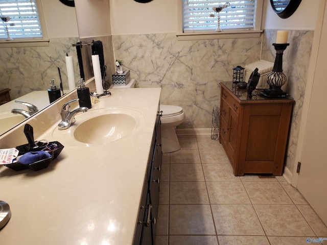 bathroom with tile patterned floors, toilet, and vanity