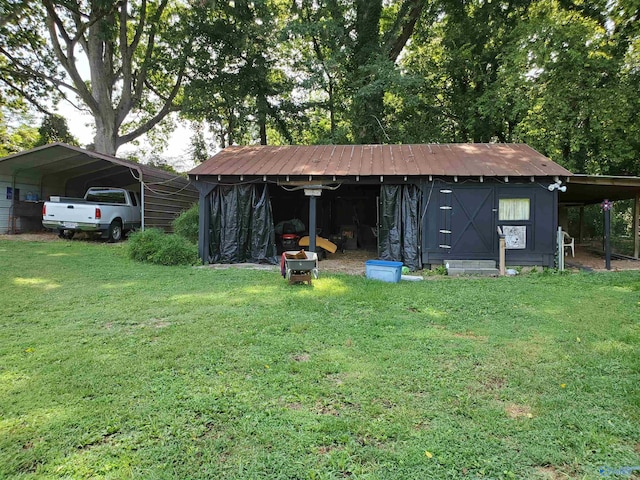 view of outdoor structure with a carport and a lawn