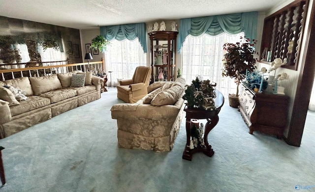 carpeted living room featuring a textured ceiling