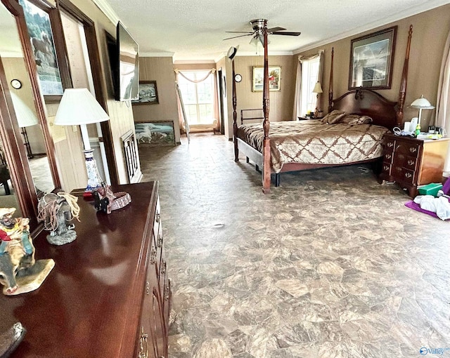 bedroom with a textured ceiling, tile patterned floors, ornamental molding, and ceiling fan