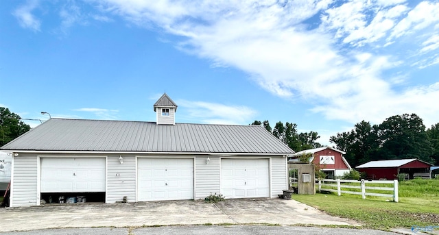 garage featuring a lawn