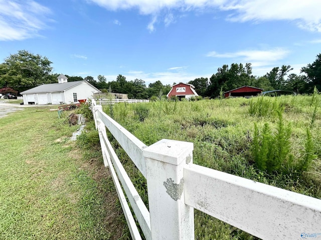 view of yard with a fenced front yard and a detached garage