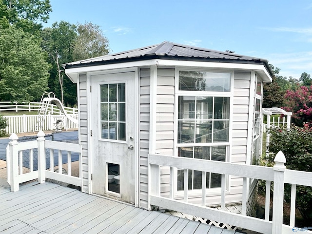 wooden terrace featuring fence